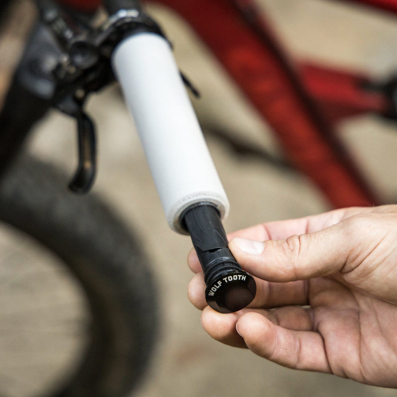 Load image into Gallery viewer, Wolf Tooth ENCASE System Storage Sleeves - Durable Aluminum Bar Plug with Vibration-Damping Rubber, Secure Trailside Repair Tool Storage, Custom Fit for Mountain & Drop Bars, Includes Extra Compartment for Presta/Schrader Adapter & Valve Core