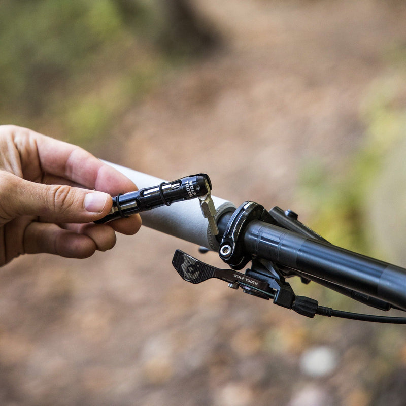 Load image into Gallery viewer, Wolf Tooth EnCase Multi-Tool with 14-Function Hex, Torx, and Wrench Components - Compact Storage Inside Handlebar, Durable Aluminum Construction, Magnetic & Swivel Design for Mountain & Road Bike Repairs