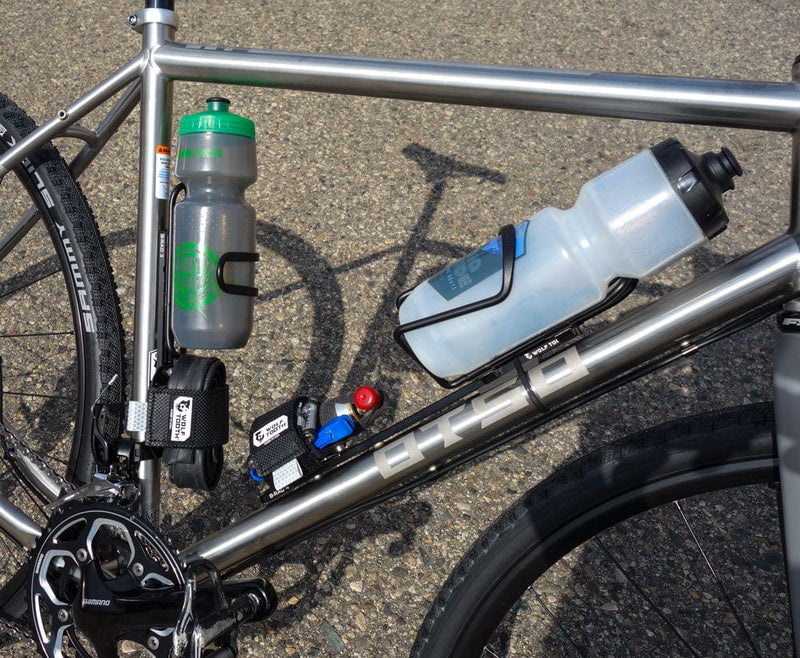 Load image into Gallery viewer, Wolf Tooth B-RAD Dogbone Aluminum Mount for Off-Center Bottle Cage