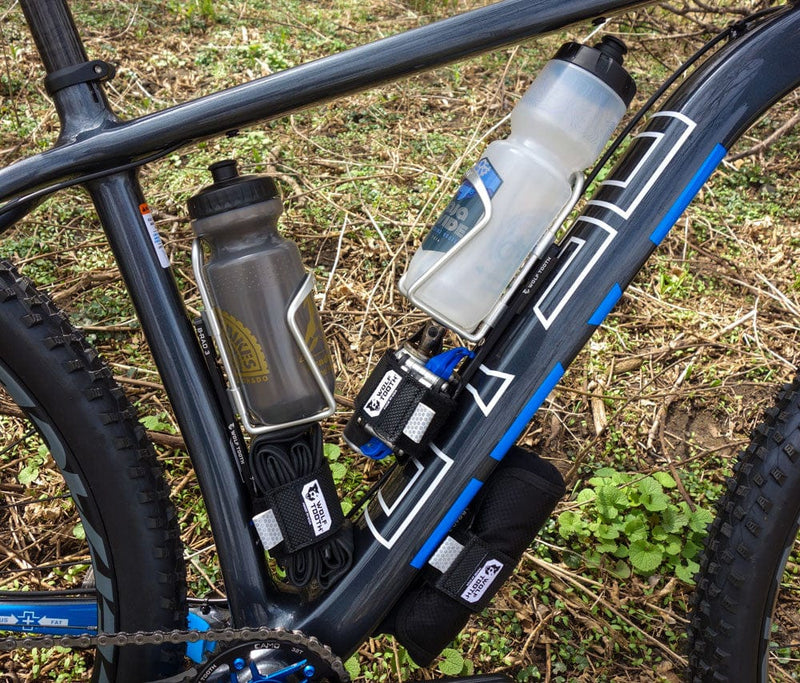 Load image into Gallery viewer, Wolf Tooth B-RAD Dogbone Aluminum Mount for Off-Center Bottle Cage
