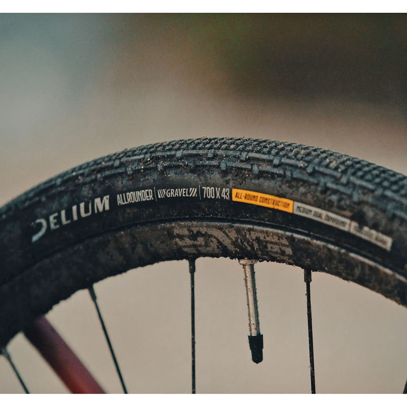 Load image into Gallery viewer, Delium Tire Allrounder Gravel Tire, 700x38, Dual Zone Casing, Blk