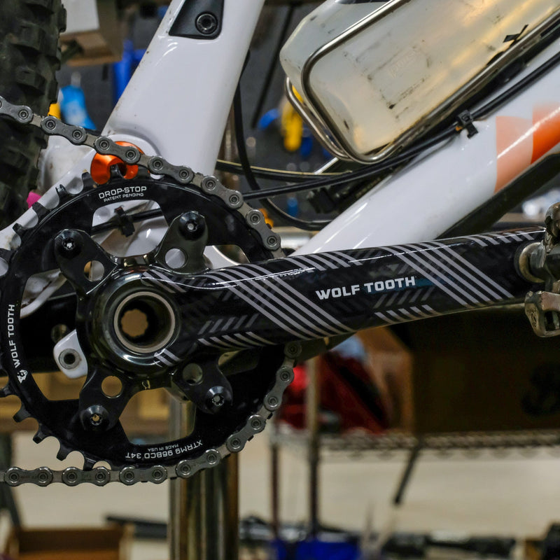 Load image into Gallery viewer, Wolf Tooth Crankskins Full-Skin Crankarm Protectors Crankarm Wrap - Logo Black