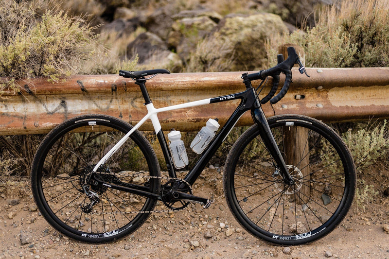 Load image into Gallery viewer, Titanium Wolf Tooth Morse Bottle Cage - Silver, Adjustable Vertical Placement, Hand-Bent Hollow Tubing, Bolt-On Compatibility for Standard Bike Frames, Lightweight and Durable Cycling Accessory