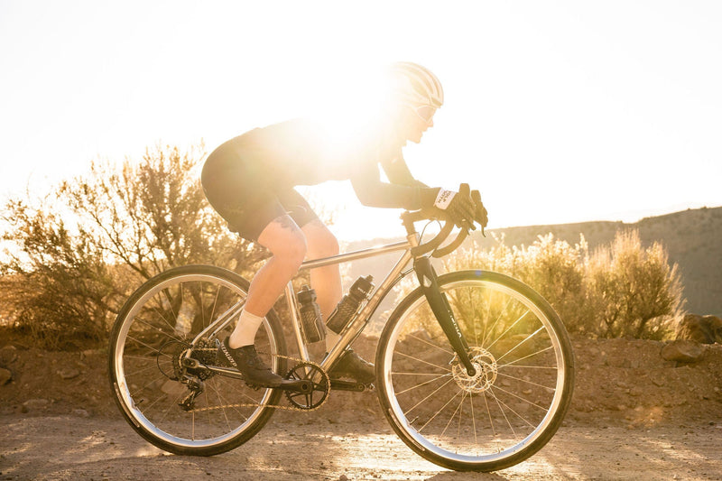 Load image into Gallery viewer, Titanium Wolf Tooth Morse Bottle Cage - Silver, Adjustable Vertical Placement, Hand-Bent Hollow Tubing, Bolt-On Compatibility for Standard Bike Frames, Lightweight and Durable Cycling Accessory