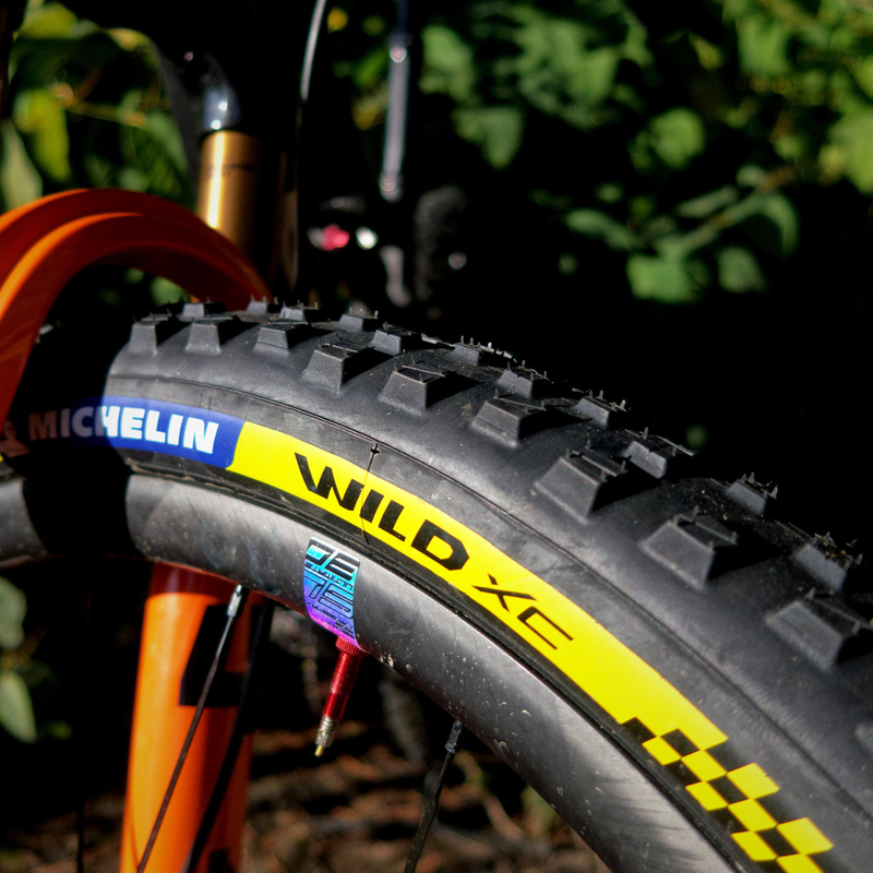 Load image into Gallery viewer, Michelin Wild XC Racing Line TS TLR 29x2.35 MTB Race Tire with Gum-X Compound, Cross Shield2 Casing, and Tubeless Technology