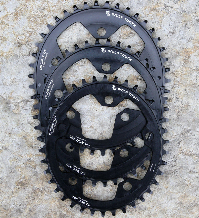 Load image into Gallery viewer, Wolf Tooth 38T Elliptical Chainring for 110 BCD, 5-Bolt, Compatible with 9-12 Speed Drive Trains, Made from 7075-T6 Aluminum, Asymmetrical Drop-Stop Tooth Design, Optimized Power Transfer, Mud Clearance &amp; Chain Retention for MTB and Gravel Riding
