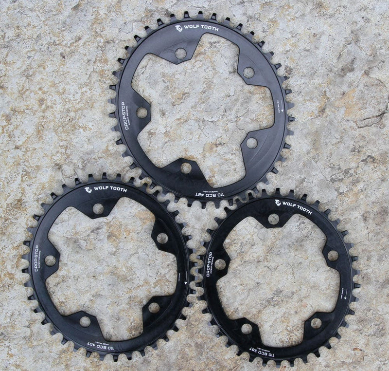Load image into Gallery viewer, Wolf Tooth 38T Drop-Stop Elliptical Chainring 110 BCD 5-Bolt Aluminum for 10 - 11 - 12-Speed Eagle, Mud-Shedding, Chain Retention, Lightweight Durable Engineering
