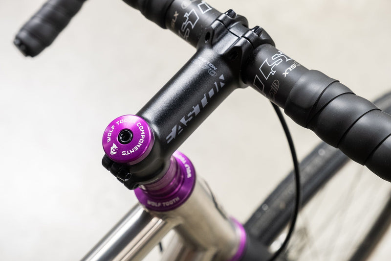 Load image into Gallery viewer, Wolf Tooth Compression Plug with Integrated Spacer Stem Cap - 7075-T6 Aluminum, Carbon &amp; Metal Fork Compatibility, Stylish Purple Finish, Bike Headset &amp; Preload Anchor
