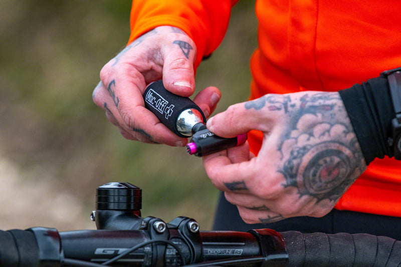 Load image into Gallery viewer, Muc-Off Road Inflator Kit Includes Two 16G Cartridges and Neoprene Sleeve
