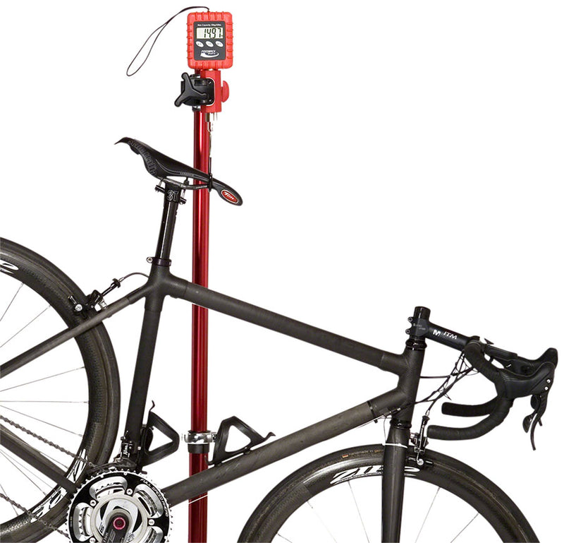 Load image into Gallery viewer, Feedback Sports Alpine Digital Scale Easily Clamped In A Bike Repair Stand
