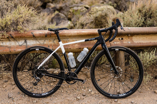 Titanium Wolf Tooth Morse Bottle Cage - Silver, Adjustable Vertical Placement, Hand-Bent Hollow Tubing, Bolt-On Compatibility for Standard Bike Frames, Lightweight and Durable Cycling Accessory